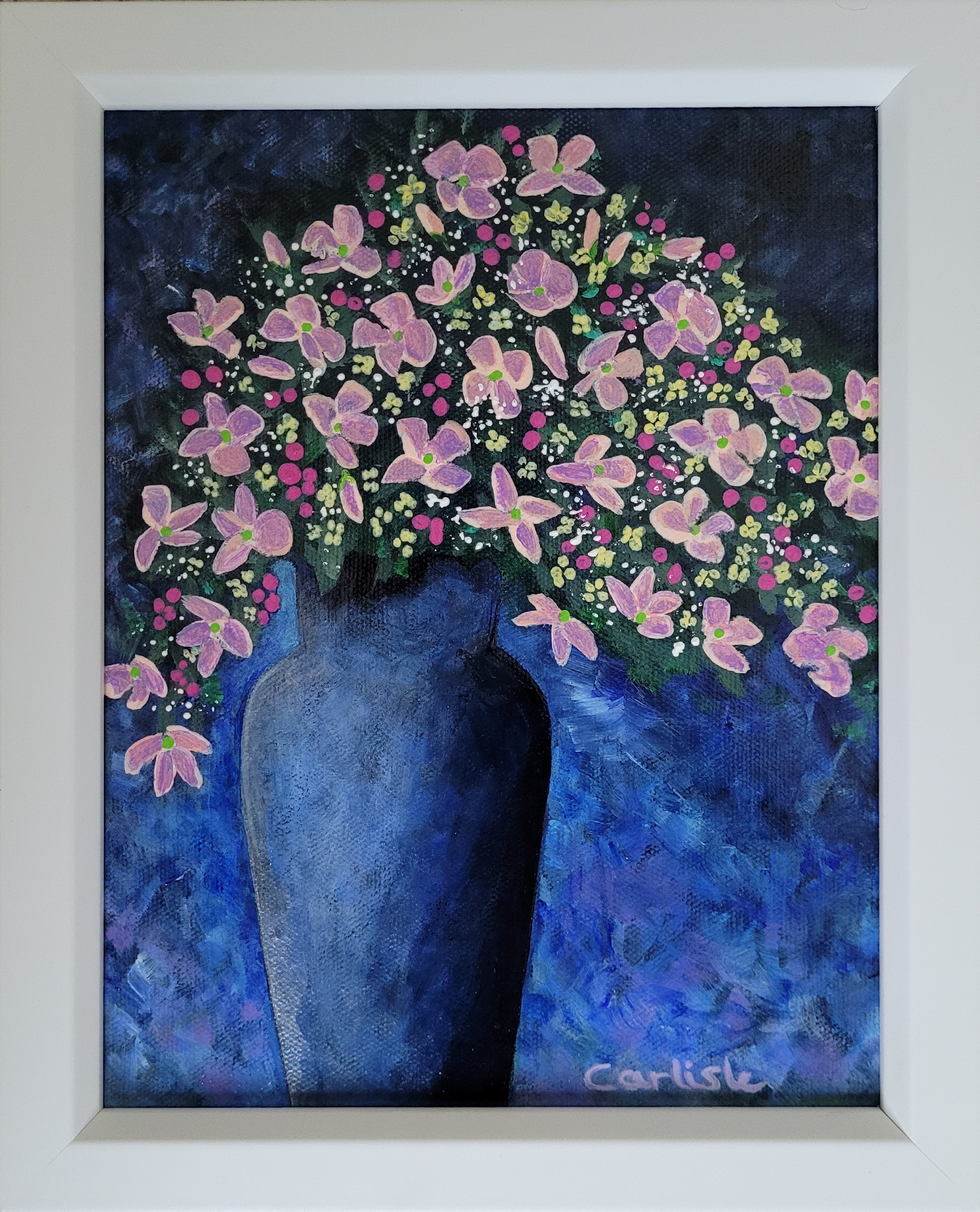 Original acrylic painting of pink flowers and berries in a tall blue vase framed in a white frame