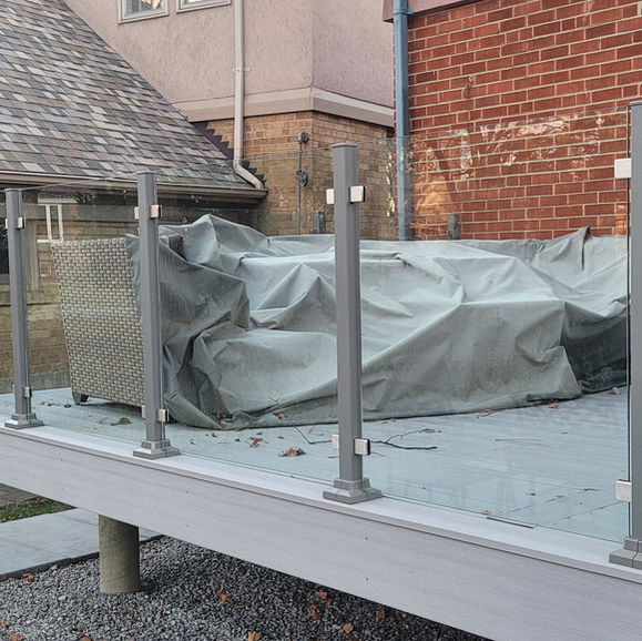 Modern deck with glass railings, Barrie deck restoration project