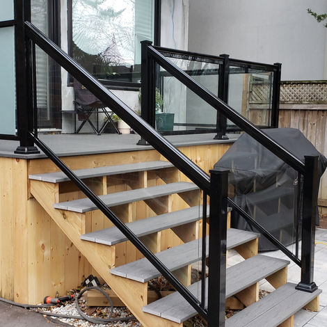 Outdoor staircase with black aluminum railings, a Barrie project.