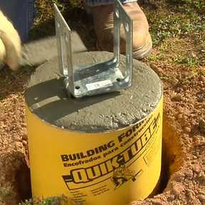 Concrete pour for post holes in Barrie