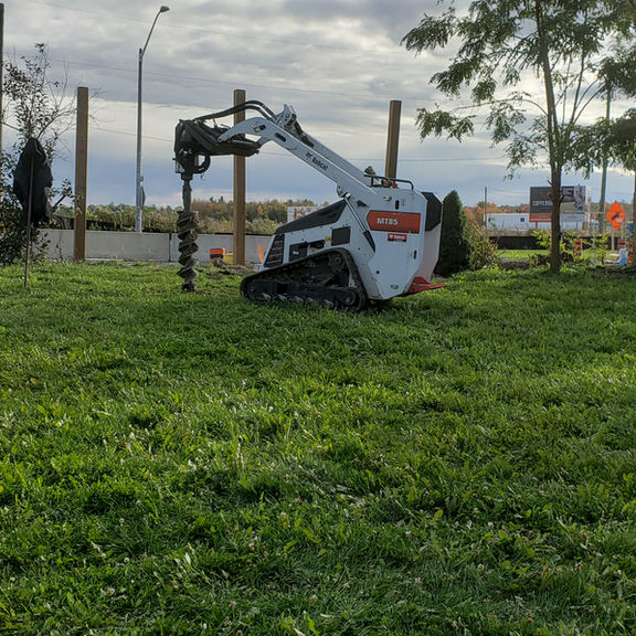 Ez Post Holes skid steer digging for Barrie fence construction