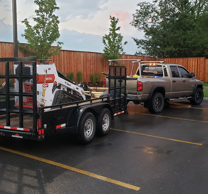 Barrie fence builders' truck, trailer, and new wooden fence
