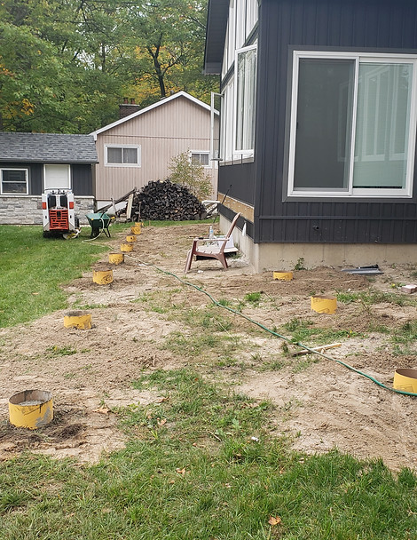newly-dug-deck-footings-filled-with-concrete