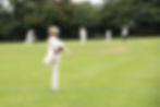 England school youth player warming up for village cricket game in the UK in summer_.jpg