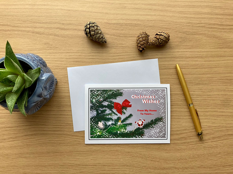 Thumbnail: Christmas Wishes card with festive design on the desk, plant pot on the left, golden pen on the right