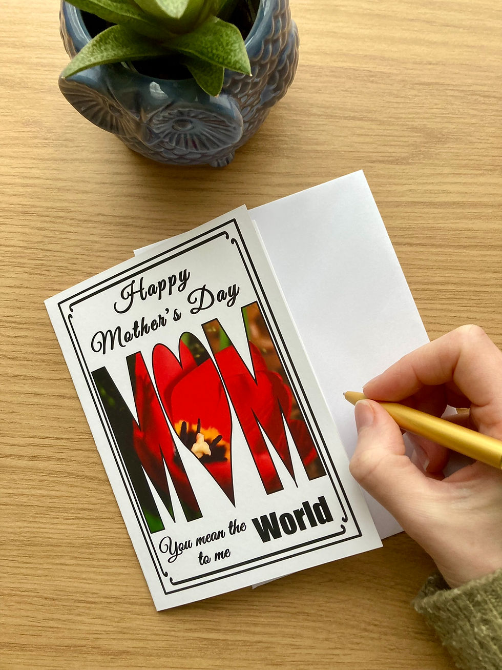 Thumbnail: Happy Mother's Day card with red tulip on a desk with a person's hand ready to write