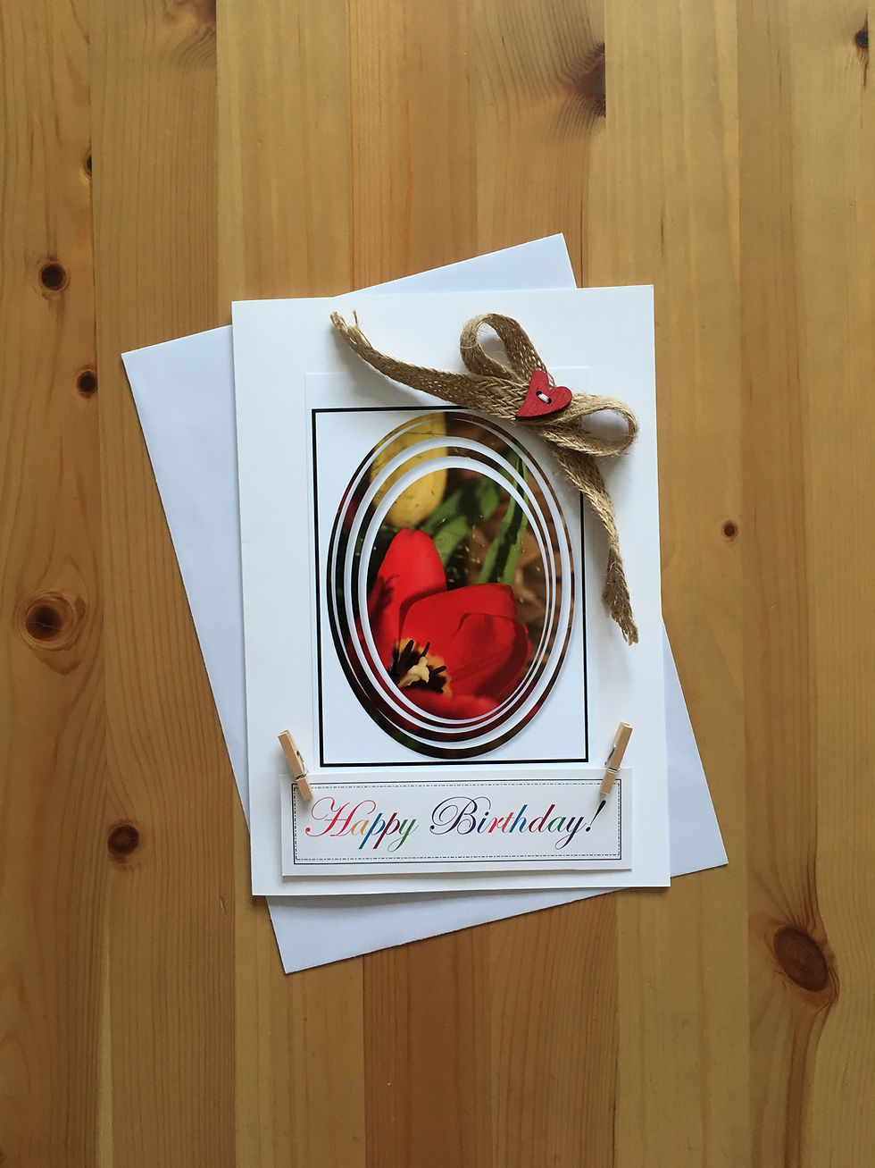 Thumbnail: Handmade birthday card with red tulip on a desk