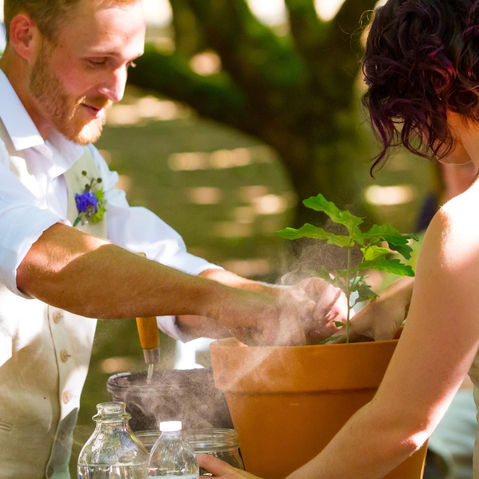 Bride and Groom in Costa Blanca plant a tree together in pot as a symbolic ritual for their wedding