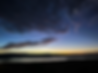 Early sunrise with crescent moon and Abiquiu Lake