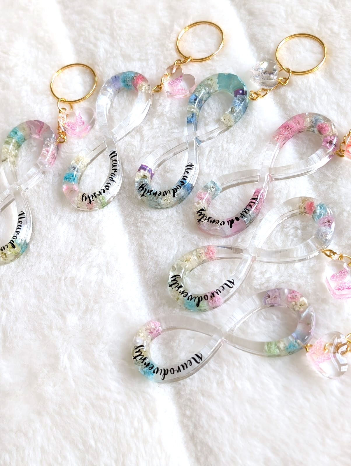 Resin infinity keychain with Autism awareness design, durable and vibrant.