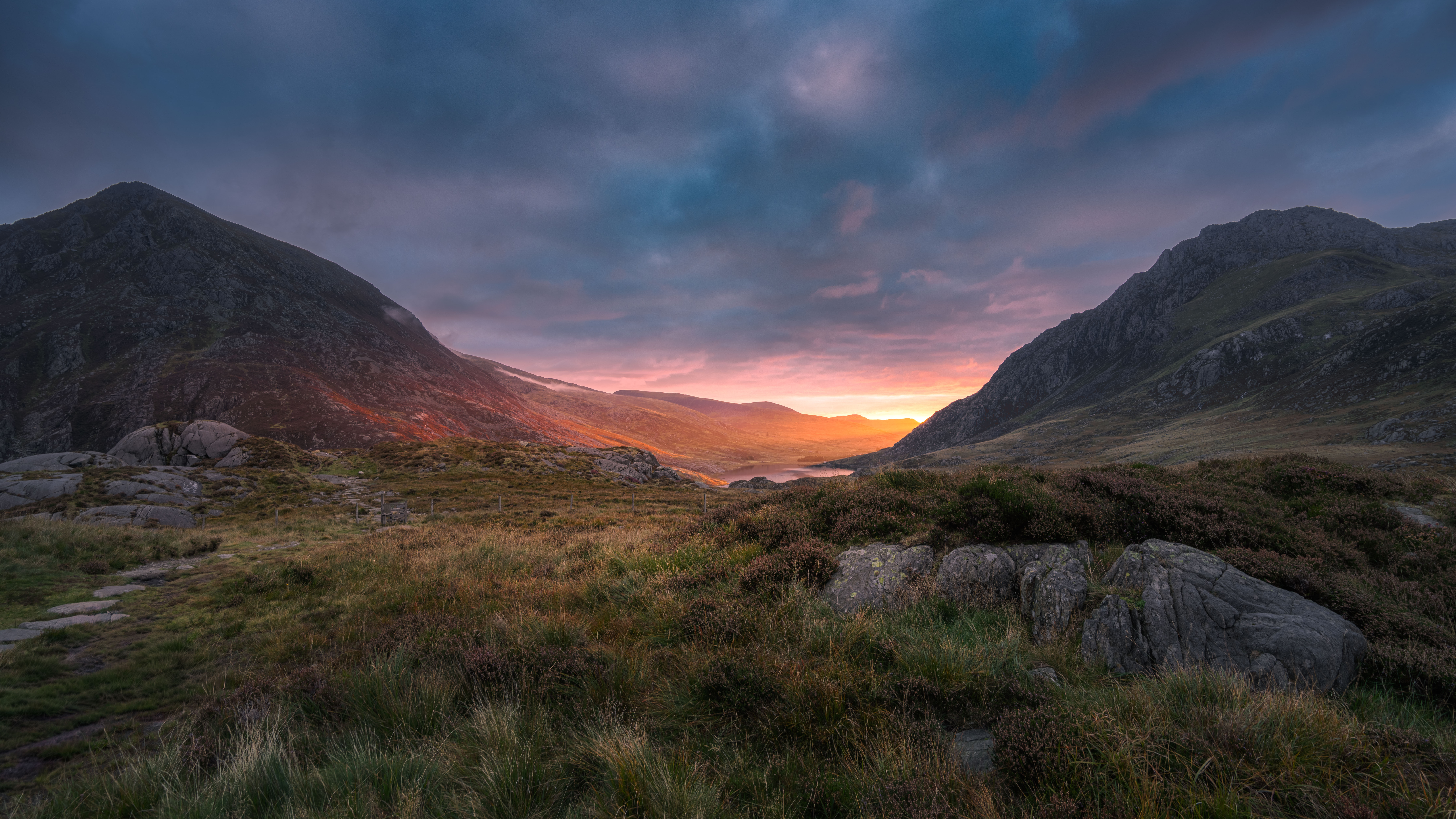 The jagged alpine peaks and serene lakes of the Ogwen Valley in Snowdonia.