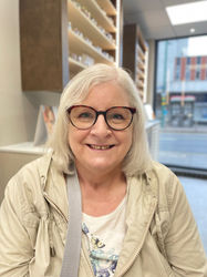 women smiling wearing new glasses