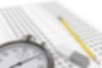 test paper with pencil, eraser and stop watch