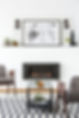 poster-above-black-fireplace-in-apartment-interior-ZLRCYB3.jpg