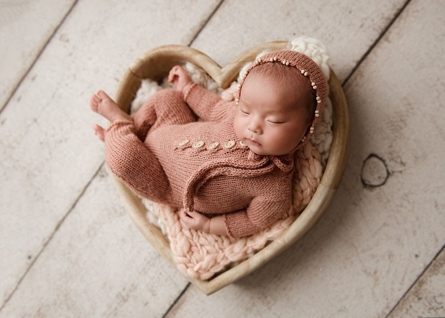 Baby photo shoot in Andover, baby girl in a pink romper
