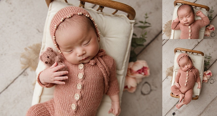 Sweet newborn baby holding a teddy