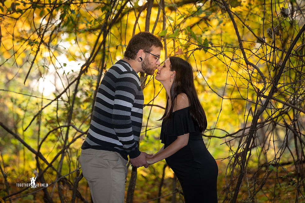 Cincinnati wedding photographer captures photograph of man kissing nose of woman in the woods.