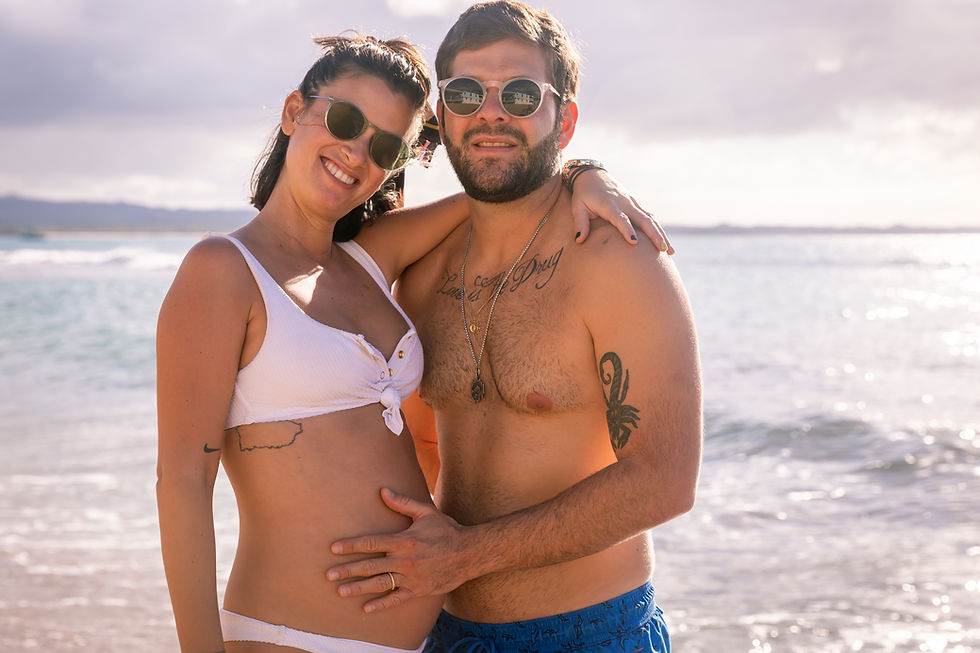 Engagement wedding photographer captures image of couple posing for a picture in the beach in Puerto Rico.