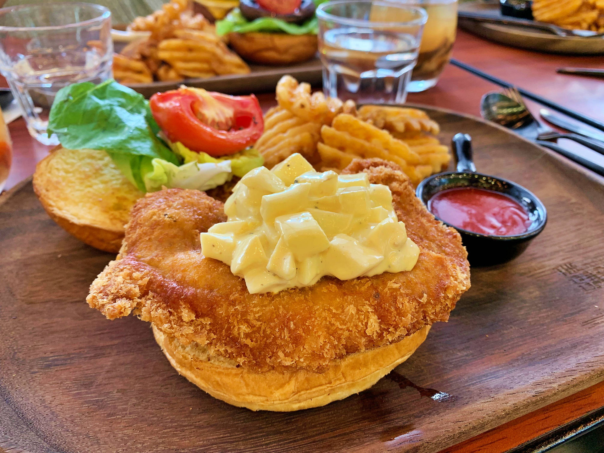 Fried Pork chop burger with potato wedges