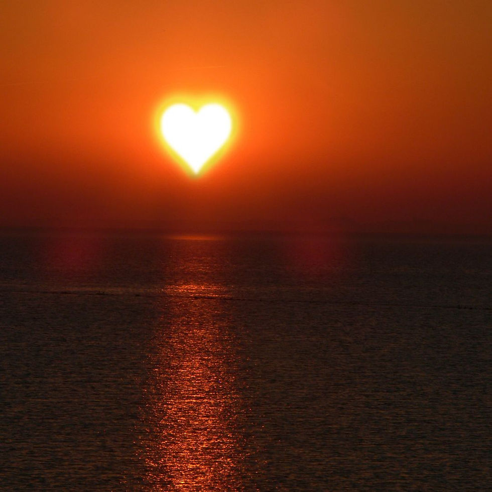 heart shaped sun with sea at sunset