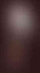 Prayer stick against a brown background