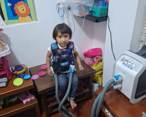 As part of CF Vests Worldwide's 5th Anniversary Celebration, CF Vests Worldwide traveled to Otavalo Ecuador to personally deliver a Philips RespirTech Cystic Fibrosis vest to Shellmita.