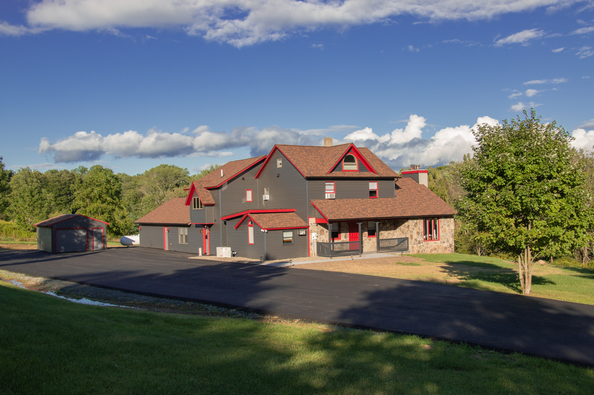 Hilltop Farmhouse, a 7-bedroom Poconos rental with a heated indoor pool sleeping 16 guests