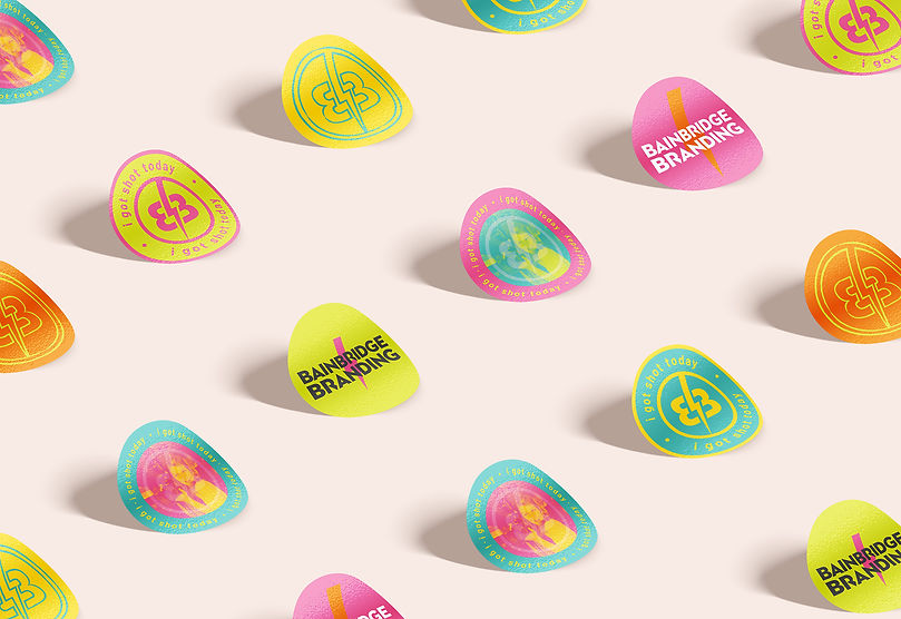 Stickers for Bainbridge Branding featuring the logo, icons, and a photo of Rose, with the tagline 'I got shot today' in brigh