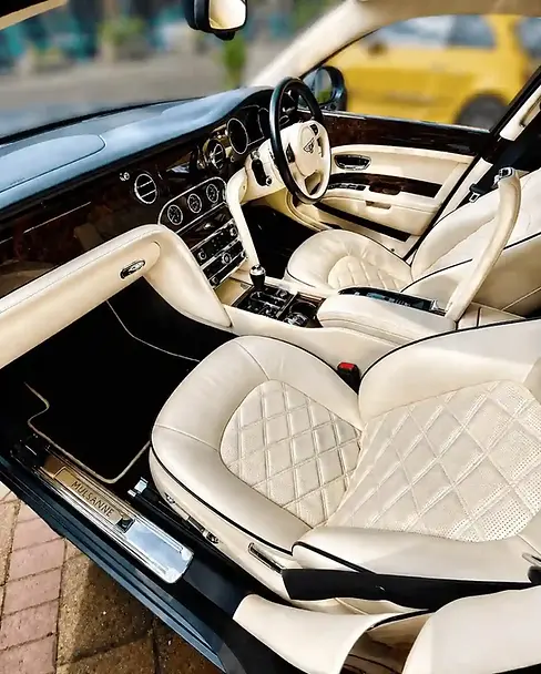 Quilted cream Bentley seats, cleaned and conditioned.