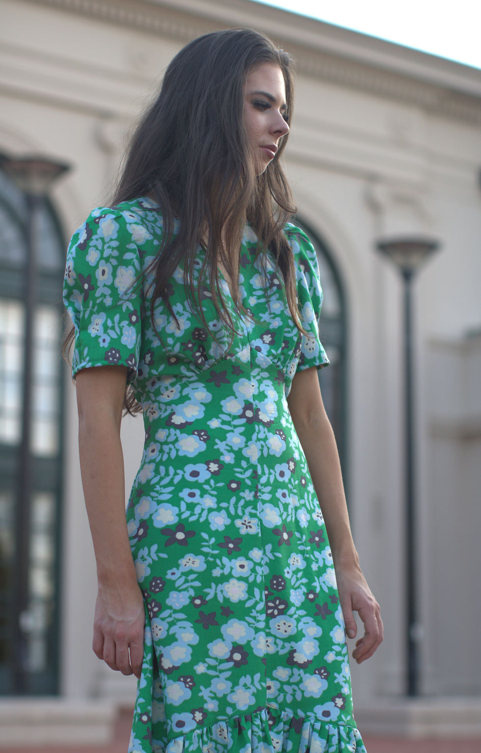 Thumbnail: Close up front view of model wearing green floral rayon dress.