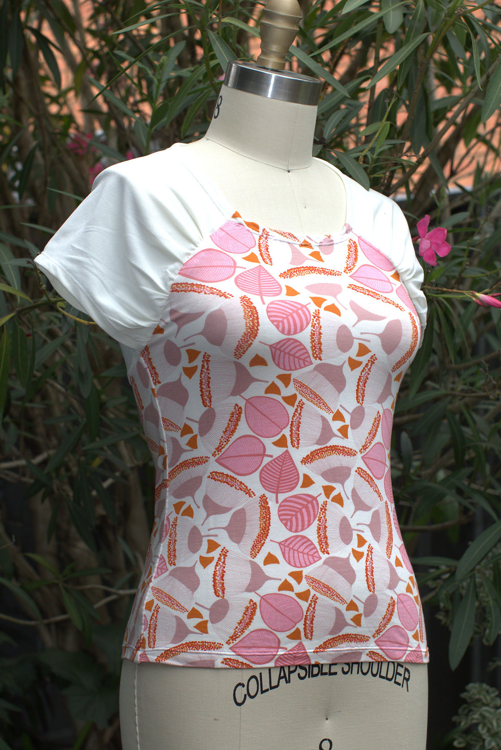 Thumbnail: Designer Luxury Jersey Tops for Women silk like feel.  The top is on a mannequin front view.