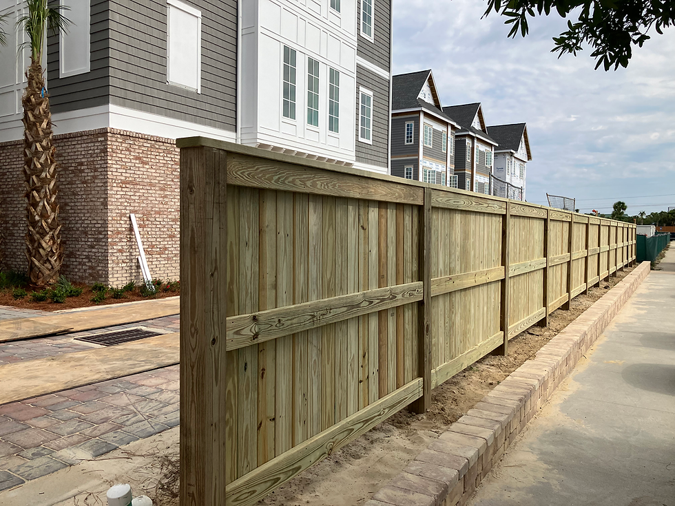Residential deck construction in Fort Walton Beach FL overlooking waterfront with wood framing and railing installation in progress