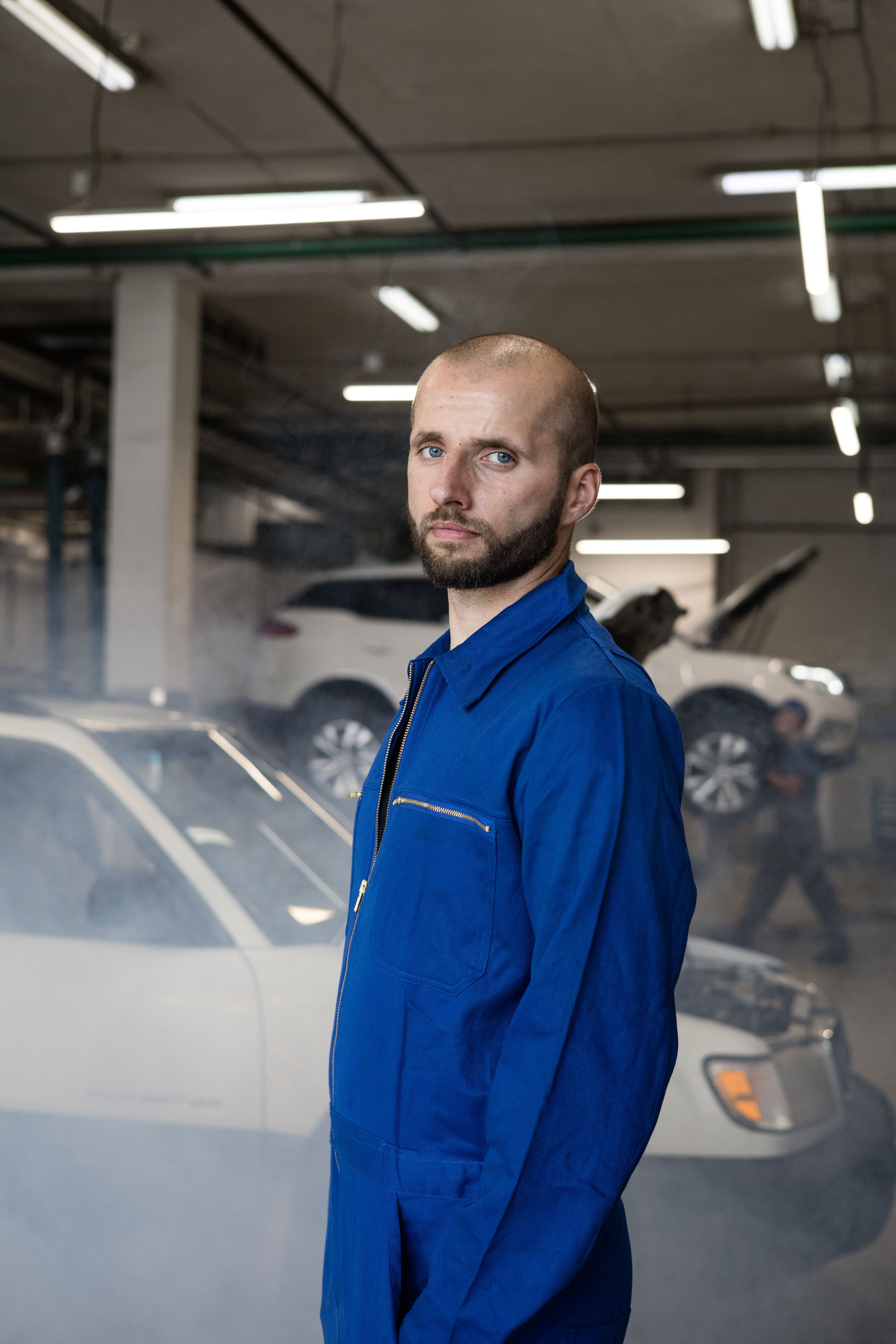 Auto mechanic performing vehicle diagnostics and repair in an automotive shop | Quicke Marketing automotive services marketing