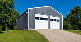 gray-metal-pole-barn-garage-white-doors.jpg