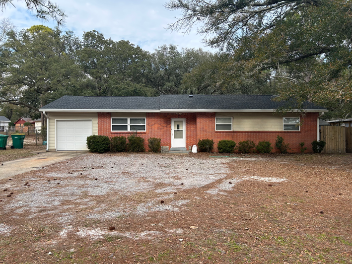 Long-time customer’s home in Mary Esther, FL with new Charcoal Timberline HDZ roof by A&M Construction