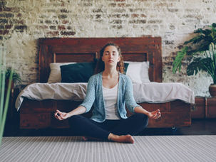 Woman meditating calmly at home, representing anxiety therapy options in Plantation FL