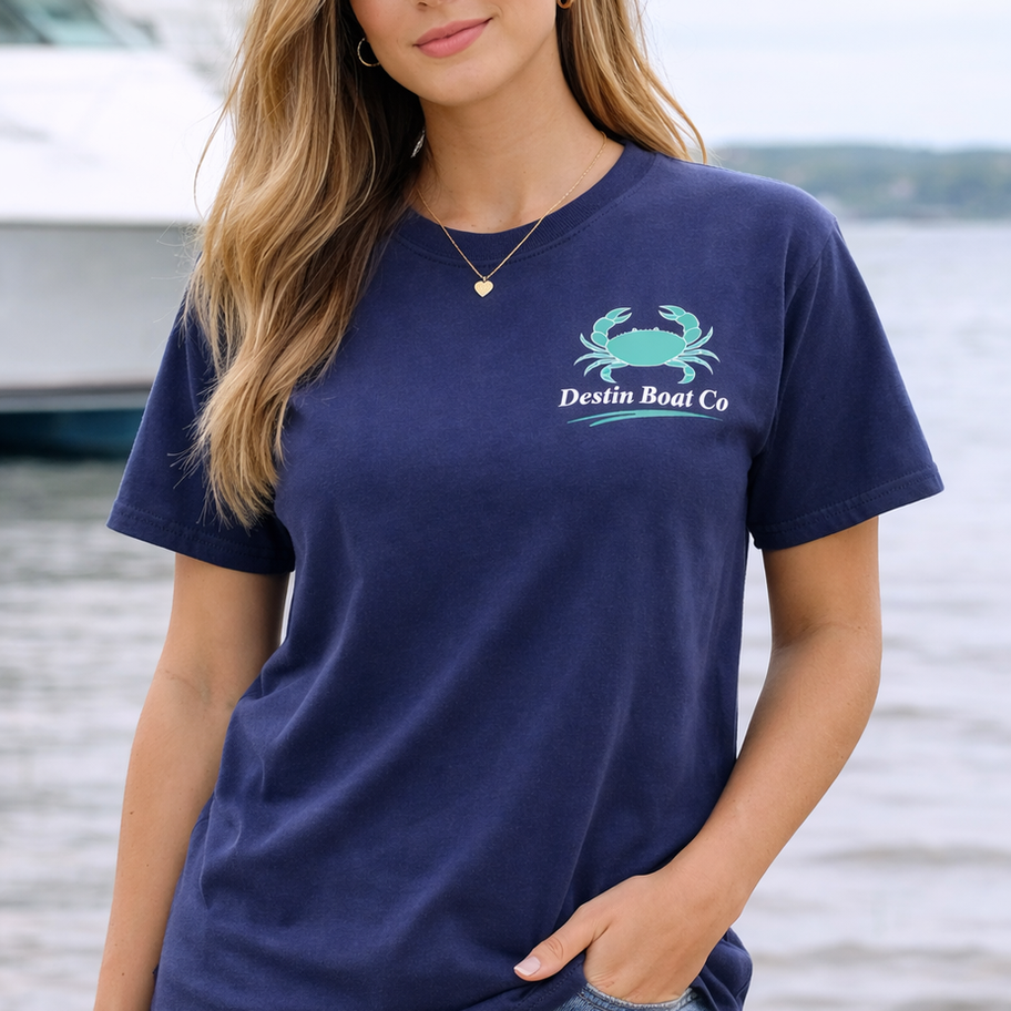 Woman wearing Destin Boat Co navy t shirt with small front crab logo relaxed fit