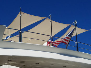 Custom shade sail installation on rooftop with tensioned fabric and structural supports