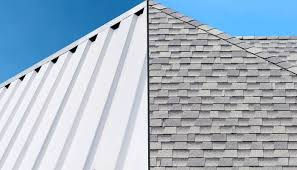 Side-by-side comparison of a white standing seam metal roof and a light gray asphalt shingle roof under brand new conditions.