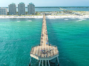 Navarre Beach Fishing Pier extending into the emerald green waters of the Gulf of Mexico along Florida’s Emerald Coast near Navarre FL.