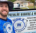 Smiling man wearing a Mikie’s Pressure Washing shirt and bucket hat standing in front of a trailer sign displaying the company’s name, services, and contact number.