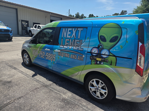 Next Level Heating and Air service van at a Fort Walton Beach FL home for seasonal HVAC maintenance