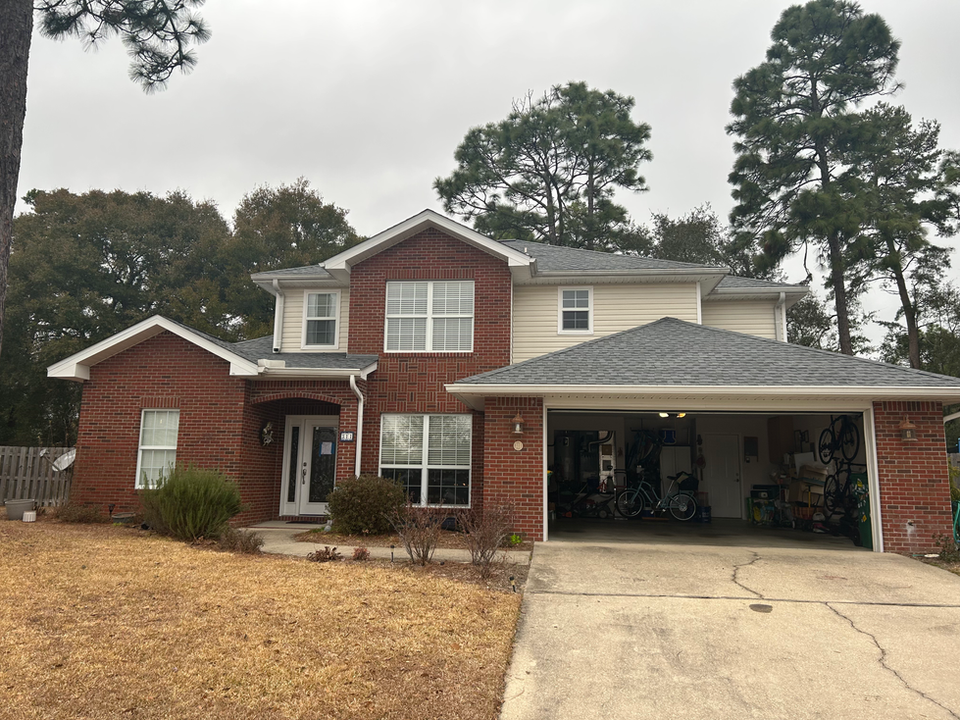 Two-story home in Niceville, FL with new Oyster Gray Timberline HDZ roof by A&M Construction