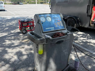 Mobile mechanic equipment and diagnostic machine set up in a parking lot near GerBear’s Certified Mobile Repair trailer in Fort Walton Beach, FL.