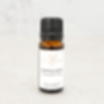 Lemongrass essential oil bottle on neutral background
