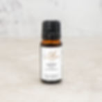 Lib’s Aromatherapy Neroli essential oil in an amber glass bottle on a light neutral background.