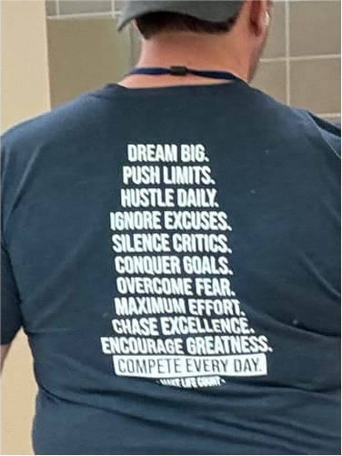 client wearing compete every day merch