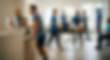 a VA greeting a PT patient at a busy outpatient therapy practice