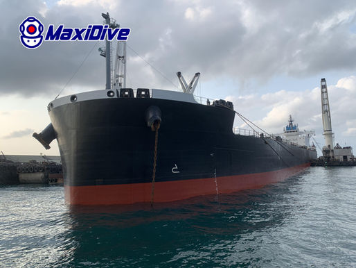 Commercial vessel at Koh Si Chang Anchorage during MaxiDive vertical side cleaning and propeller polishing support in Thailand