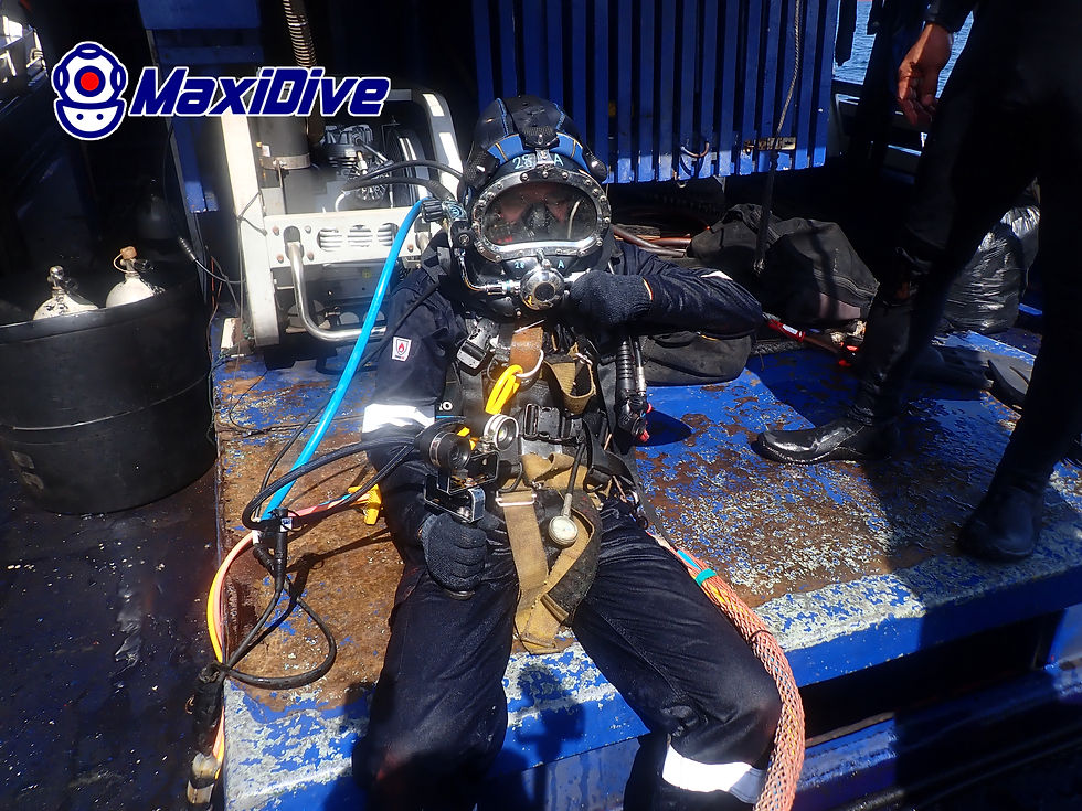 MaxiDive commercial diver preparing surface-supplied diving equipment for in-water survey in Thailand